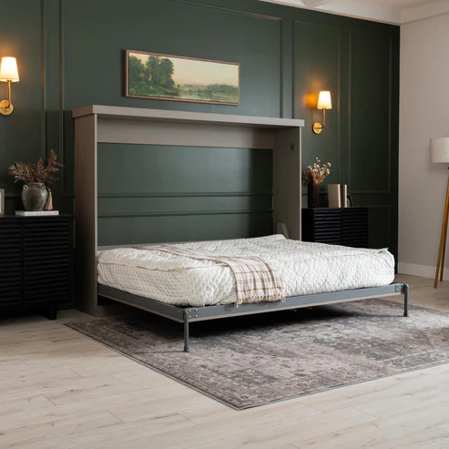 Murphy Door® wall bed frame in light gray with fold-down design, shown against dark green walls with textured mattress and plaid throw.
