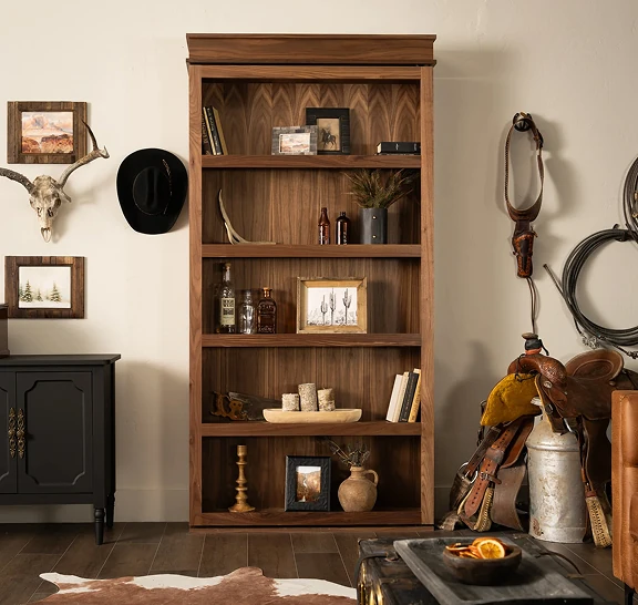 Murphy Door® Surface Mount Door, a dark wood hidden bookshelf, blends seamlessly in a rustic-themed room.